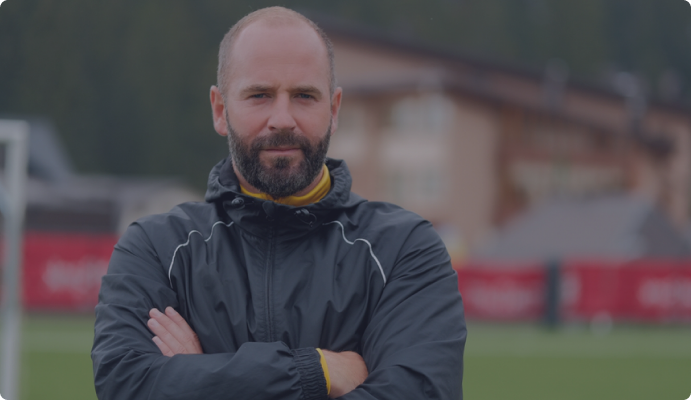 Coach leading an athletic team trip in Spain