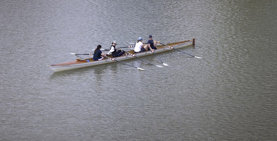 Crew rowing shell on the water for elite rowing gap year