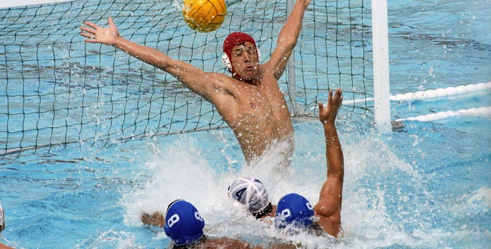 Water polo goalkeeper blocking a shot for elite gap year