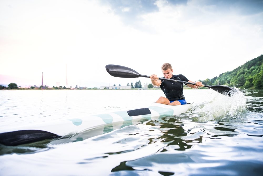 Student athlete training in a kayak