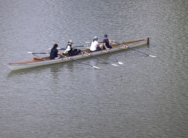 Four scull on the water