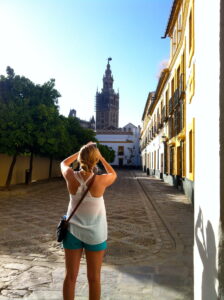 SAIIE student photographing Seville Cathedral from the Patio de los Naranjos