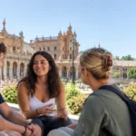 University students talking in Plaza de España, Seville, Spain